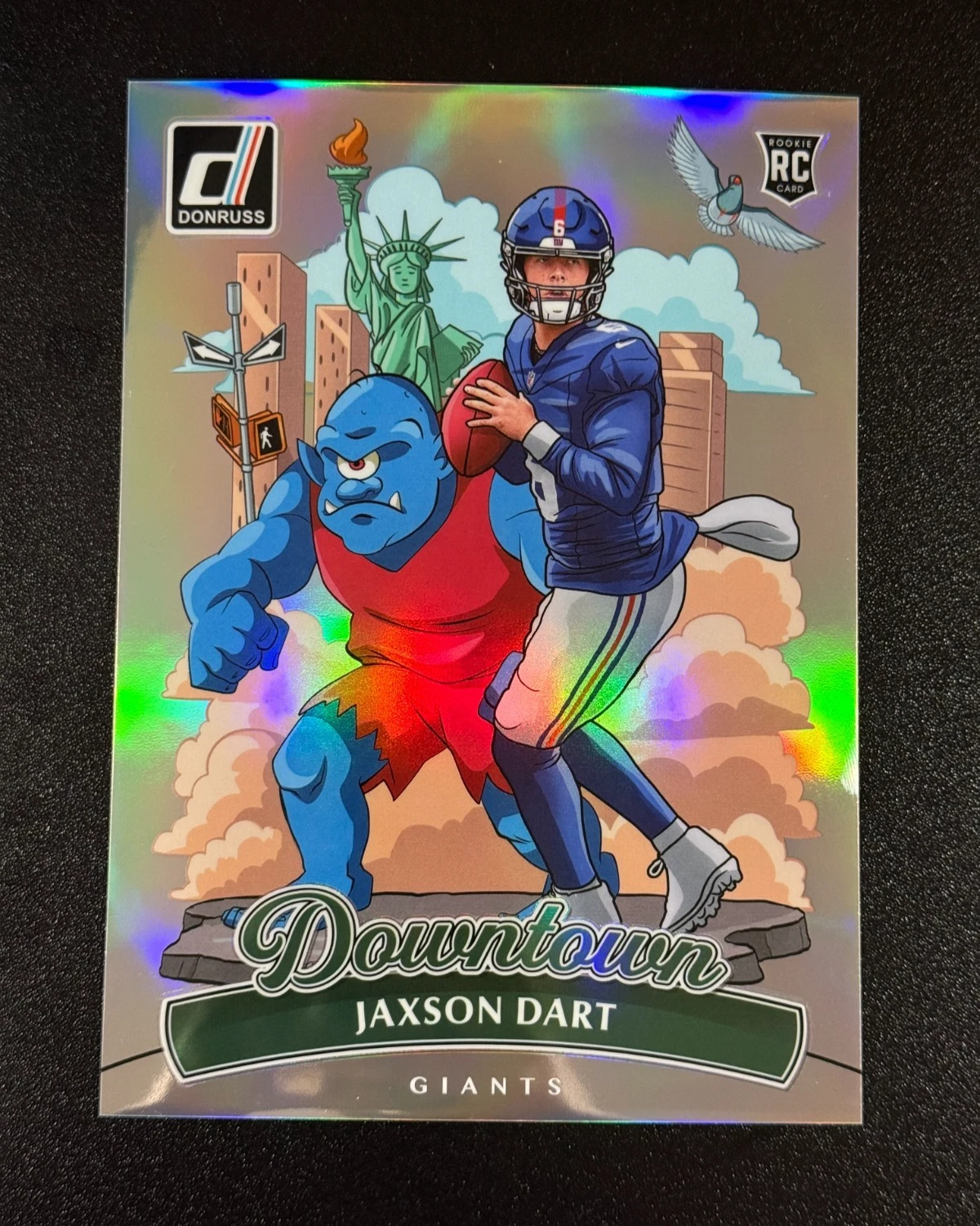 Jaxson Dart Donruss Downtown insert with illustrated city-themed artwork
