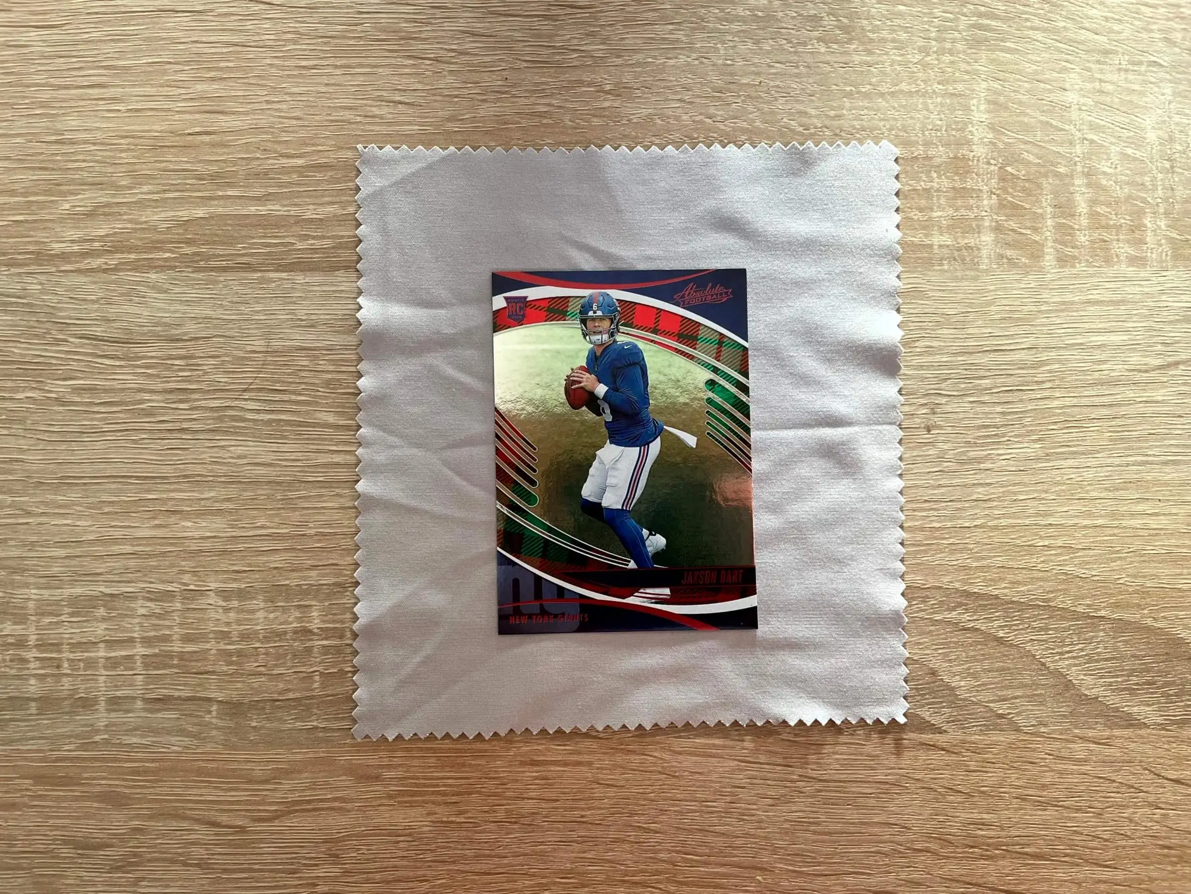 Clean card handling workspace with a soft mat, good lighting, and cards laid out safely