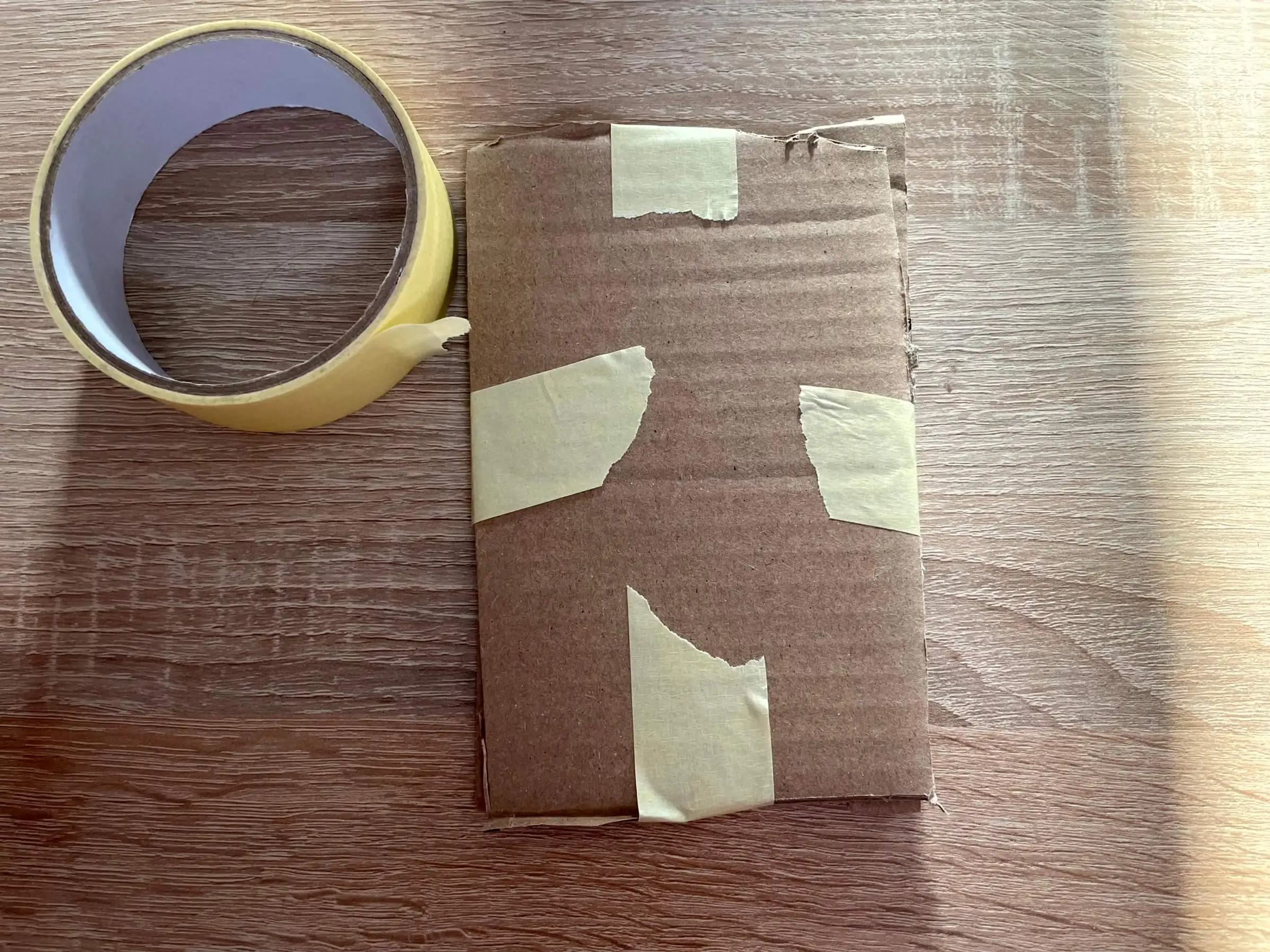 Cards secured between two cardboard pieces in a protective sandwich